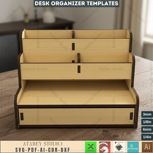 May include: A wooden desk organizer with multiple compartments and a drawer. The organizer has a light wood finish with dark brown trim. The text "DESK ORGANIZER TEMPLATES" is at the top. The bottom of the image has the text "ATABEY STUDIO SVG-PDF-AI-CDR-DXF".