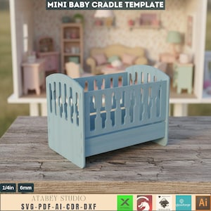 May include: A light blue mini baby cradle template made of wood. The cradle has a slatted design and is displayed on a wooden surface. The text "MINI BABY CRADLE TEMPLATE" is at the top. The cradle is 1/4 inch (6mm) thick. The bottom of the image has the text "ATABEY STUDIO SVG-PDF-AI-CDR-DXF".