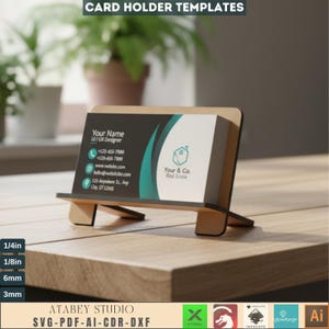 May include: A wooden card holder with a business card featuring contact information and a real estate logo. The holder is angled for display and has a natural wood finish. The text "CARD HOLDER TEMPLATES" is at the top.