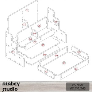 May include: Isometric view of a disassembled wooden organizer with numbered parts. The design includes a main structure with shelves, a drawer, and interlocking pieces. The image also includes the text "Atabey Studio" and "SVG-AI-DXF CDR-PDF FILES READY EASY LASER CUT FILES."