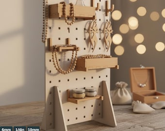 May include: A wooden pegboard stand with various accessories, including shelves, hooks, and decorative wooden earrings. The stand is white with a grid of holes and is holding necklaces, jars, and a small wooden box. The text "PEGBOARD STAND TEMPLATES" is at the top.