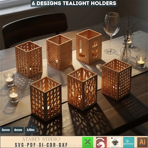 May include: Six wooden tealight holders with various geometric and nature-inspired cut-out designs. The holders are square-shaped and made of light-colored wood. The image includes lit tealight candles, a wine glass, and the text "6 DESIGNS TEALIGHT HOLDERS".
