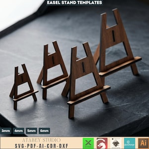 May include: Wooden easel stand templates in various sizes. The stands are brown with a rectangular base and a triangular top. The text "EASEL STAND TEMPLATES" is at the top. The bottom of the image has the text "ATABEY STUDIO SVG-PDF-AI-CDR-DXF".