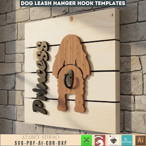 May include: Wooden dog leash hanger with a dog silhouette and the name "Princess". The hanger has a metal hook and is mounted on a light-colored wooden board. The text "DOG LEASH HANGER HOOK TEMPLATES" is at the top.