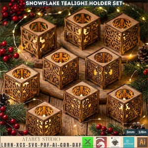 May include: A set of eight wooden snowflake tealight holders. Each cube-shaped holder features intricate snowflake cutouts and a circular opening for a tealight. The text "SNOWFLAKE TEALIGHT HOLDER SET" is at the top. The holders are 1/8in thick.