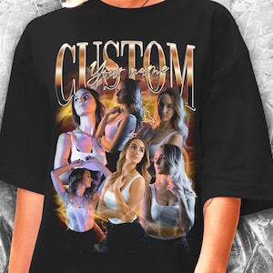 May include: Black oversized t-shirt with a graphic print of five women in a vintage style with the text "CUSTOM your name".