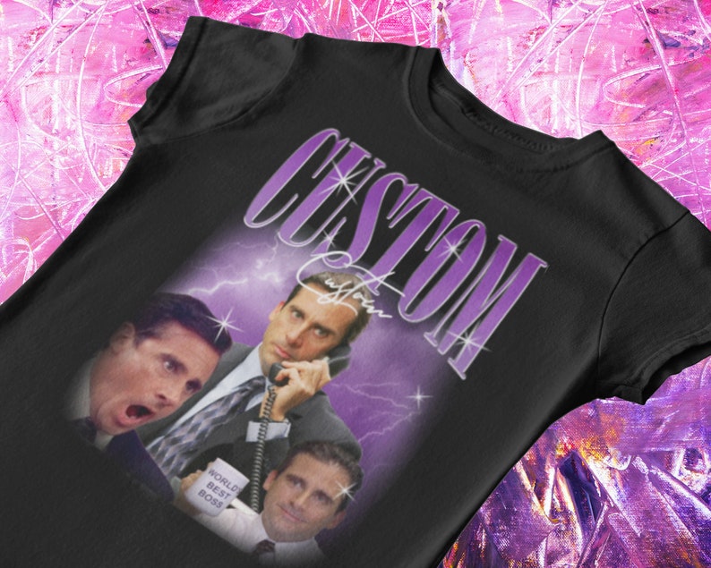May include: Black t-shirt with a purple and white graphic of Michael Scott from the TV show "The Office". The graphic features Michael Scott in three different poses, with the text "CUSTOM" above him.