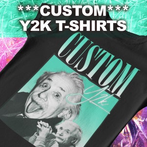May include: Black t-shirt with a teal and white graphic print of Albert Einstein sticking his tongue out. The graphic also includes the text "CUSTOM" in a stylized font.