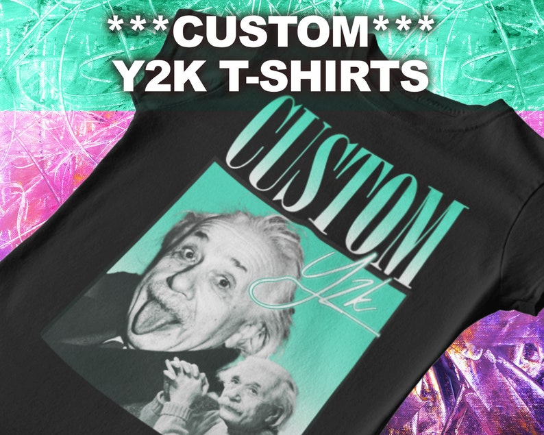 May include: Black t-shirt with a teal and white graphic print of Albert Einstein sticking his tongue out. The graphic also includes the text "CUSTOM" in a stylized font.