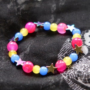 Pansexual/Panromantic pride flag star beaded gemstone bracelet. The beads are the pan flag colors (pink, yellow, cyan) and holographic stars.