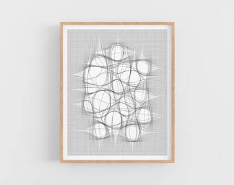May include: A black and white abstract geometric print with a grid pattern and overlapping circles. The print is framed in a light wood frame.