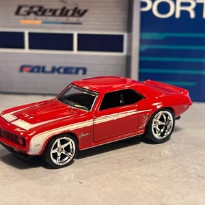 Hot Wheels ‘67 Chevy Camaro red with Real Rider wheel swap chrome
