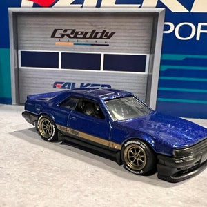 Hot Wheels Flying Customs Nissan Skyline RS Blue Target. With Real