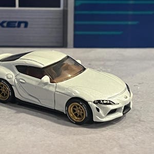1:64 scale matchbox custom diecast Toyota supra GR white with real rider swap