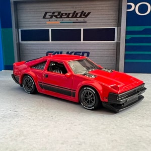 Hot wheels 1982 Toyota Supra red mainline with custom real rider wheel swap