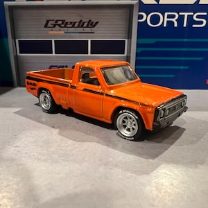 Hot wheels mazda repu orange with custom real rider swap
