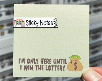 May include: A square, pale yellow sticky note featuring a repeating faint dollar sign pattern. The text reads, I'M ONLY HERE UNTIL I WIN THE LOTTERY, accompanied by a graphic of a tan money bag overflowing with green cash bills.