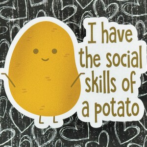 May include: A white sticker with a cartoon potato with a happy face and the text "I have the social skills of a potato".