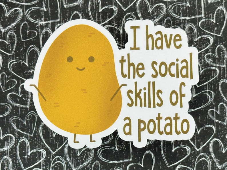 May include: A white sticker with a cartoon potato with a happy face and the text "I have the social skills of a potato".