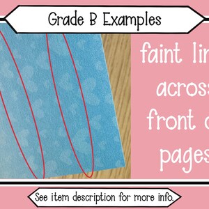 May include: A light blue card with a repeating heart pattern featuring two vertical red ovals highlighting faint lines across the front. The text Grade B Examples appears at the top, and See item description for more info. is at the bottom.