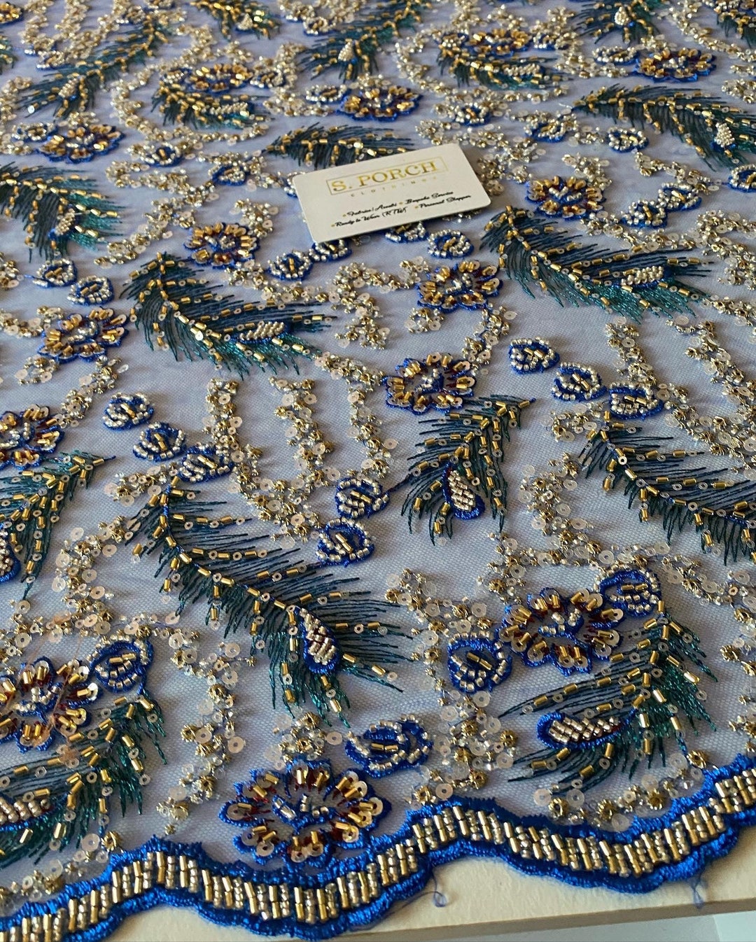 Elegant hand beaded design embroider on a glitter mesh lace-prom-sold by the yard. Clear Nude