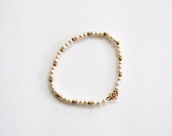 B.A. Ballou 14K Gold and Pearl Baby Bracelet from Birks Baby s First Jewelry Birks Jewelry Freshwater Pearl Bracelet