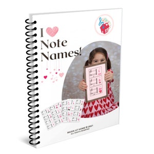 May include: A spiral bound book with a pink heart and the text "I Love Note Names!" on the cover. The cover also features a small illustration of a house with a musical note above it. The book is designed for learning music notes.