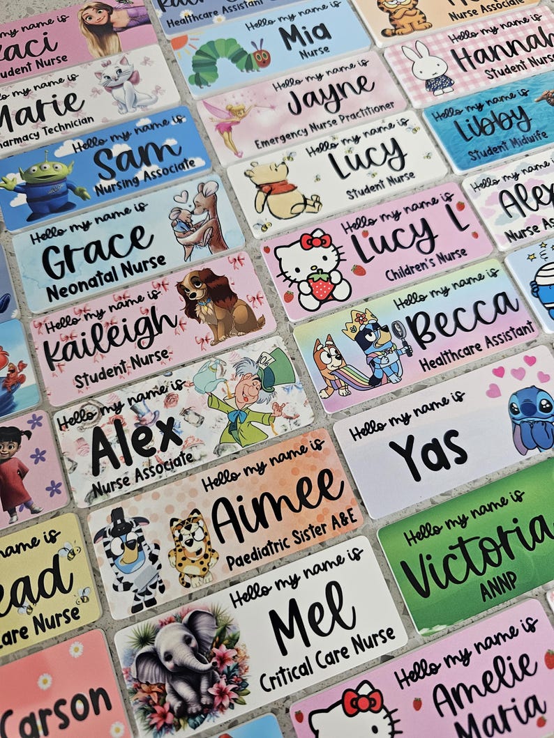 May include: A collection of rectangular name badges featuring various cartoon characters and professional titles. Each badge displays the text Hello my name is followed by a personalized name and job role, printed in a mix of script and sans-serif fonts.