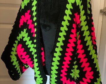 Bright colored neon and black boho rave festival crochet cardigan sweater