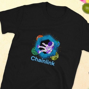 May include: Black t-shirt with a graphic of an astronaut floating in space with the text "Chainlink" underneath.