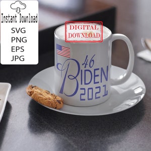 May include: White ceramic mug with a blue and white design that says "46 Biden 2021". The mug also has a small American flag on it. The mug is sitting on a white saucer with a chocolate chip cookie on it. The mug has a red stamp that says "Digital Download".