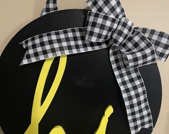 Black and yellow 18” door hanger