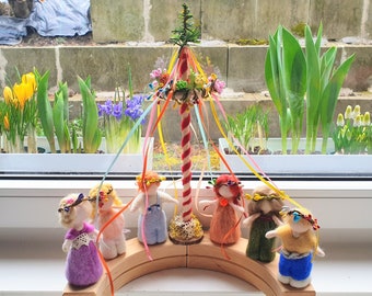 Maypole, rainbow with bunting, spring garland, seasonal table, daffodil, birthday plug, ladybug, bee, flower child, lamb, shepherd