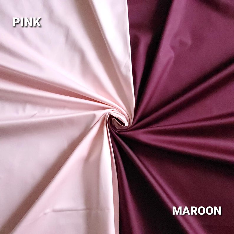 May include: A fabric sample showing two colours, pink and maroon. The pink fabric is on the left, and the maroon fabric is on the right. The word "PINK" is in white text on the upper left, and "MAROON" is in white text on the lower right.