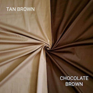 May include: A close-up of two fabric swatches, one tan brown and the other chocolate brown. The fabric is gathered in a spiral, showcasing the different textures and colours. The words "TAN BROWN" and "CHOCOLATE BROWN" are printed on the fabric.