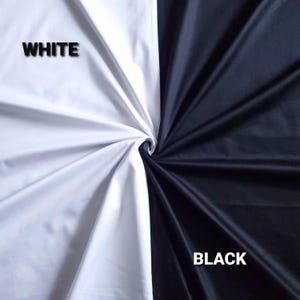 May include: A divided image displaying two fabric samples. One section is pure white, the other is jet black. The words "WHITE" and "BLACK" are printed on each side. The fabric is twisted at the centre.