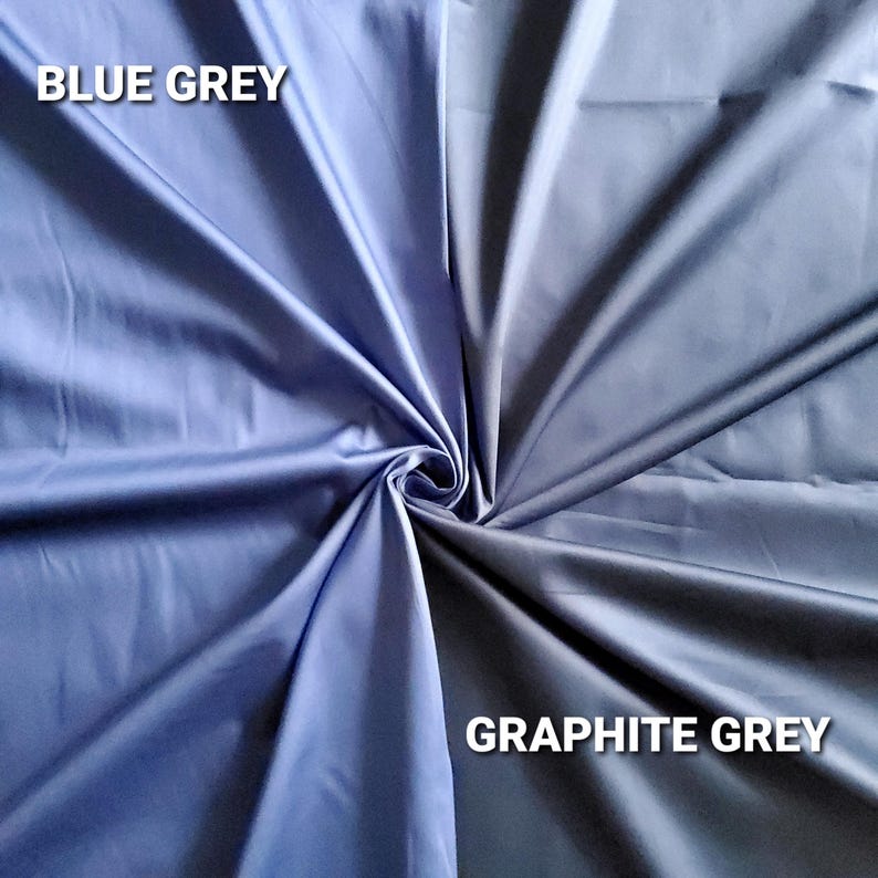 May include: A close-up of two fabric swatches, one in blue-grey and the other in graphite grey. The fabric is folded and draped, with the text "BLUE GREY" and "GRAPHITE GREY" in white.
