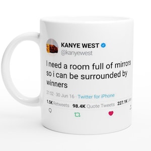 May include: White ceramic mug with a blue and white Twitter post featuring Kanye West's quote: "I need a room full of mirrors so I can be surrounded by winners." The post includes the date, time, number of retweets, quote tweets, and likes.
