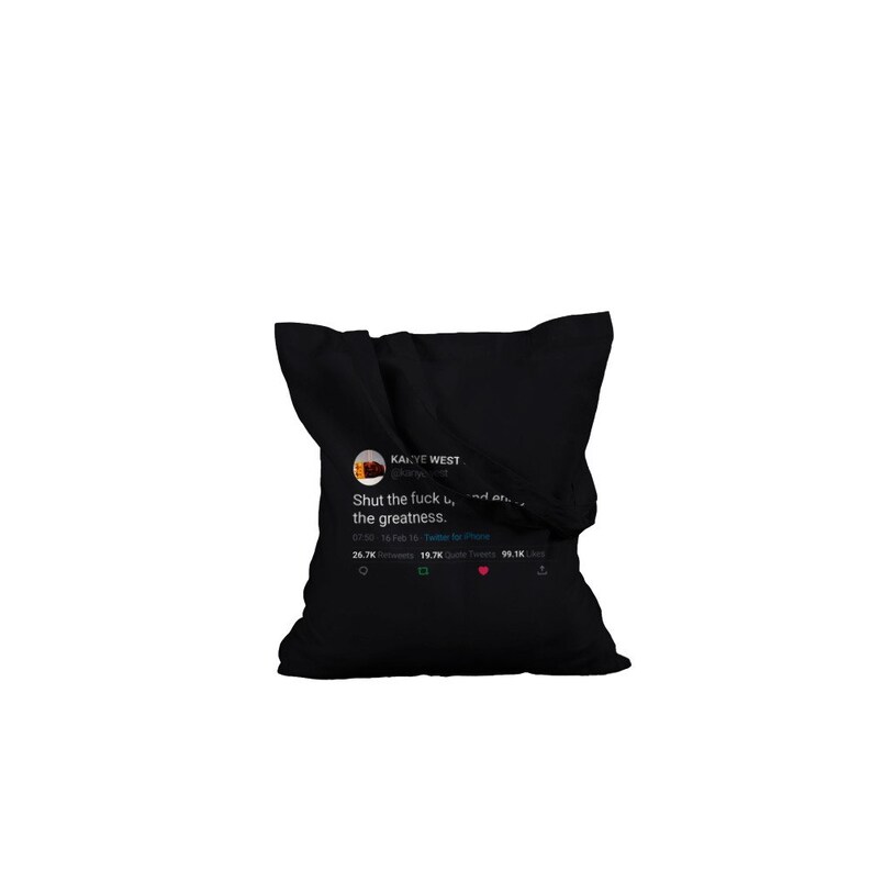 May include: Black pillow with a white and blue Twitter post printed on it. The post is from Kanye West and says "Shut the fuck up, and enjoy the greatness."