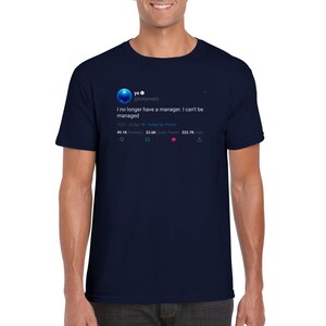 May include: A navy blue t-shirt featuring a white graphic of a tweet from Kanye West's Twitter account. The tweet reads "I no longer have a manager. I can't be managed." The tweet has 49.1K retweets, 22.6K quote tweets, and 222.7K likes.