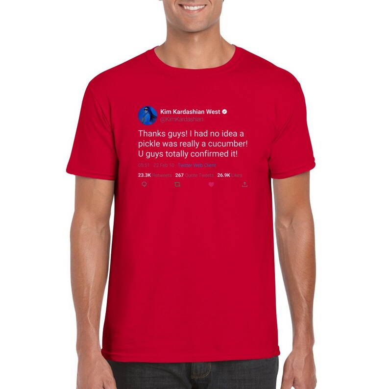 May include: Red t-shirt with a tweet from Kim Kardashian West on it. The tweet reads: "Thanks guys! I had no idea a pickle was really a cucumber! U guys totally confirmed it!" The tweet has 23.3K retweets, 267 quote tweets, and 26.9K likes.