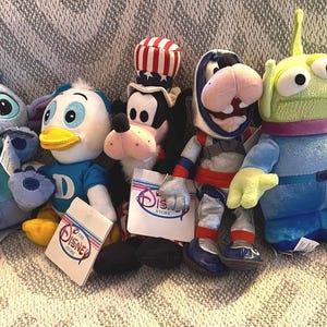 Vintage Disney Plush Collection: Flounder, Pooh, Goofy, Alien, Stitch, Dewey image 1