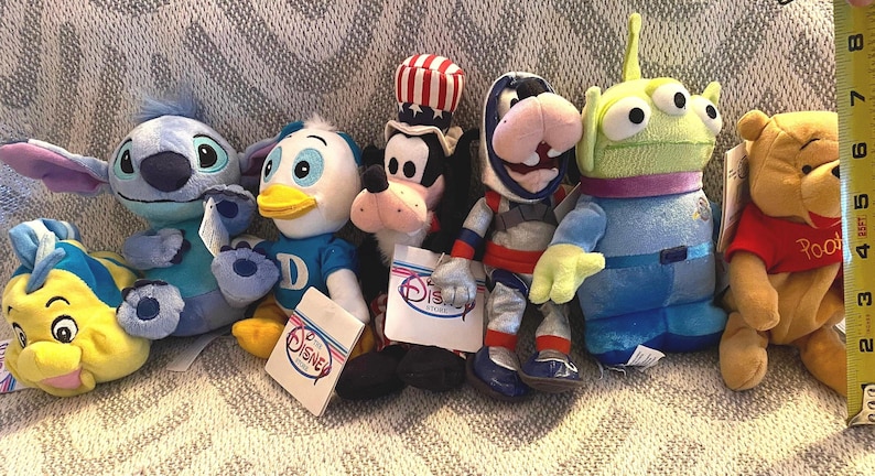 Vintage Disney Plush Collection: Flounder, Pooh, Goofy, Alien, Stitch, Dewey image 1