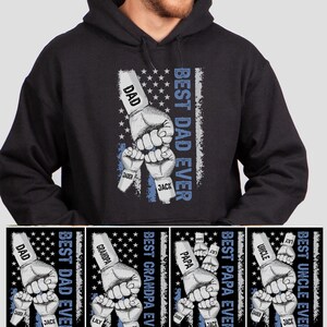 May include: Black hooded sweatshirt with a graphic of fists holding hands with the text "Best Dad Ever" and the names "Dad", "Jaden", and "Jack".