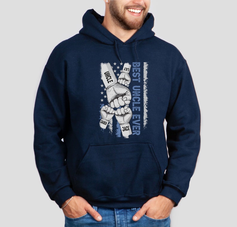 May include: Navy blue hooded sweatshirt with a graphic of five fists with the names "Lily", "Uncle", "Saben", "Jack", and "Best Uncle Ever" printed on the fists. The graphic is on a blue and white American flag background.