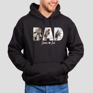 May include: Black hoodie with a white "DAD" graphic featuring photos of a man with his children. The text "Jasmine &hearts; Jack" is below the graphic.