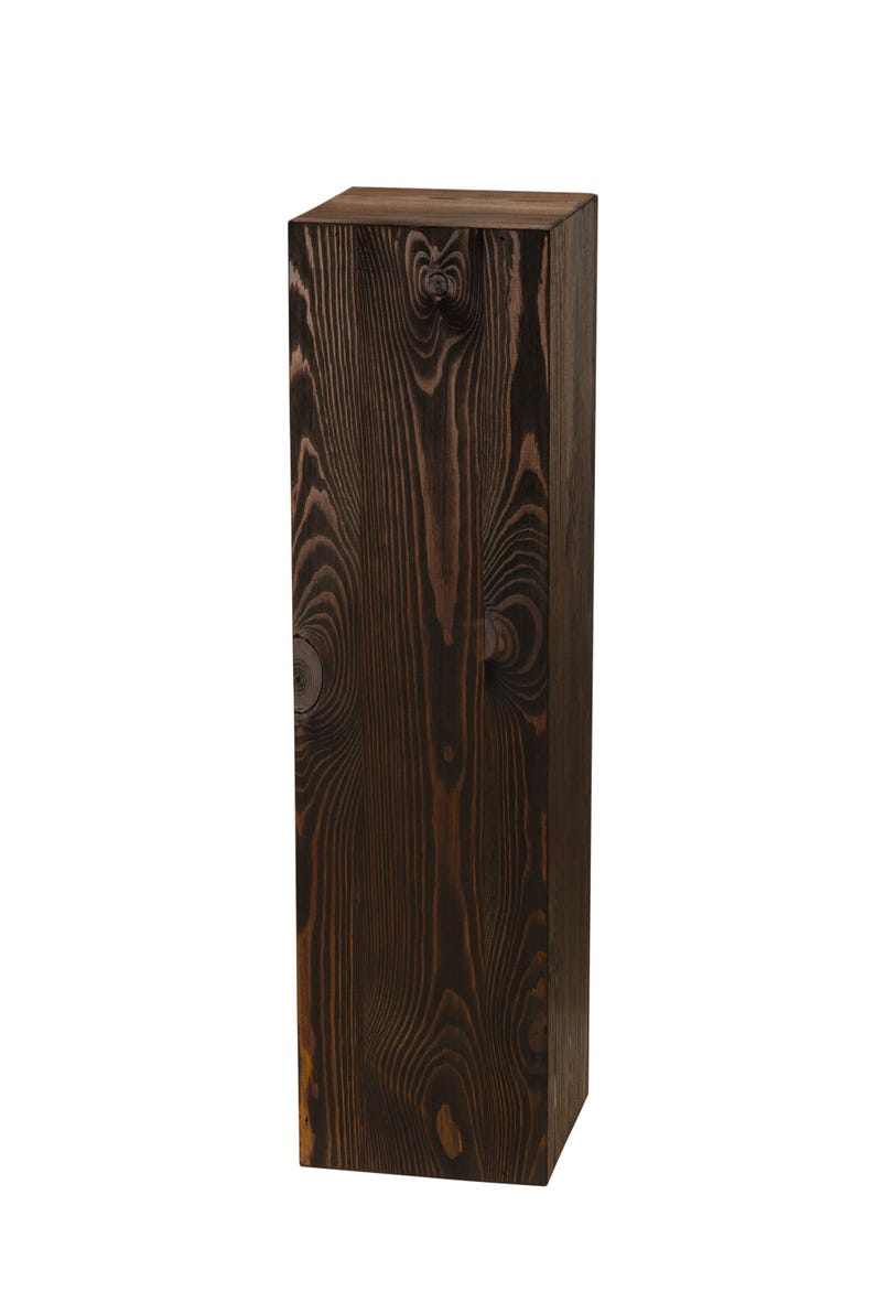 May include: A tall, dark brown wooden box with a natural wood grain pattern. The box is made of solid wood and has a rectangular shape.