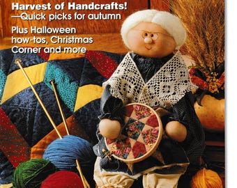 May include: A magazine cover featuring a handmade doll holding a quilt square. The magazine is titled "Crafting Traditions" and the cover text reads "Harvest of Handcrafts! - Quick picks for autumn. Plus Halloween how-tos, Christmas Corner and more."