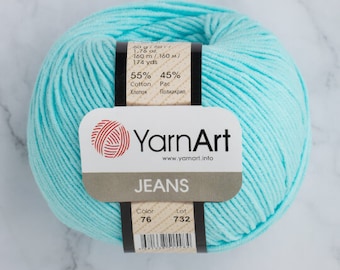 May include: A skein of light blue yarn labeled "YarnArt Jeans" with the details: 55% Cotton, 45% Acrylic, 160 meters, 174 yards, Color 76, Lot 732.