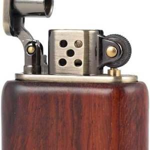 May include: A brown wooden lighter with a silver and black metal top. The lighter has a flip top lid and a small wheel on the side.